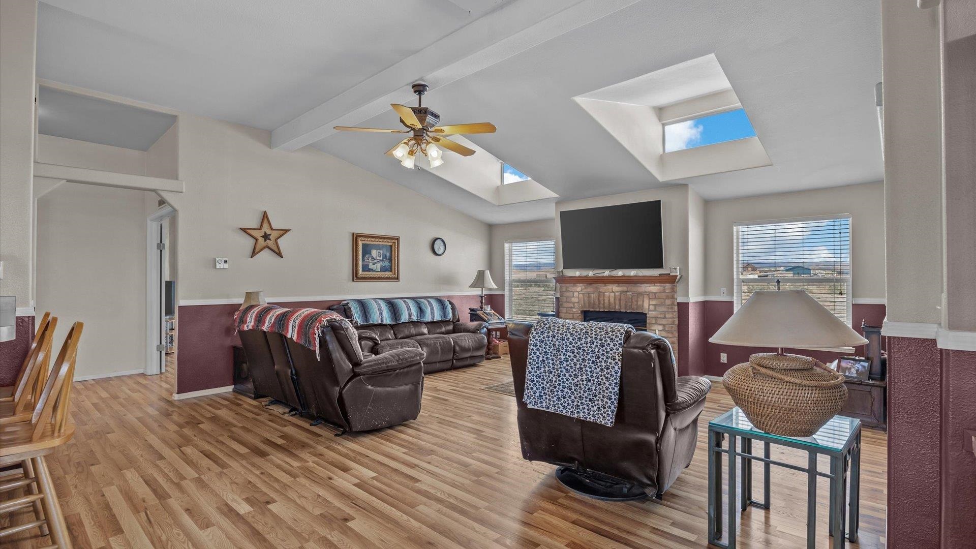 710 Old Highway Mack, CO 81525 - Photo 11 of 40 a living room with furniture a flat screen tv and a fireplace