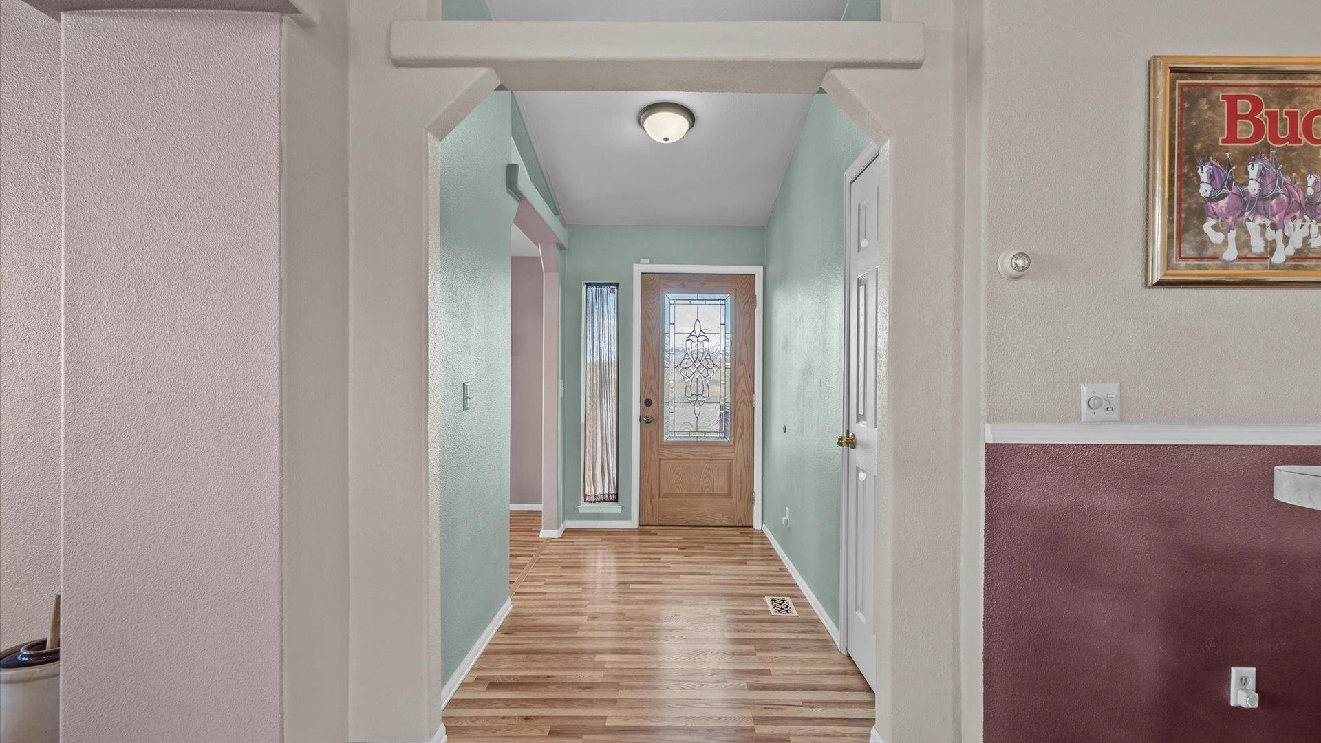 710 Old Highway Mack, CO 81525 - Photo 14 of 41 a view of a hallway with wooden floor and a bathroom