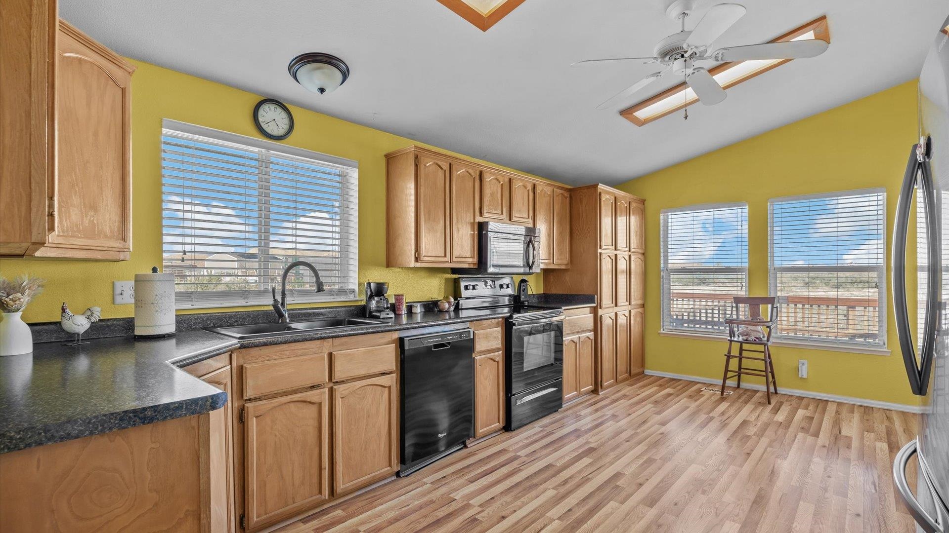 710 Old Highway Mack, CO 81525 - Photo 16 of 40 a kitchen with a sink a counter top space and stainless steel appliances