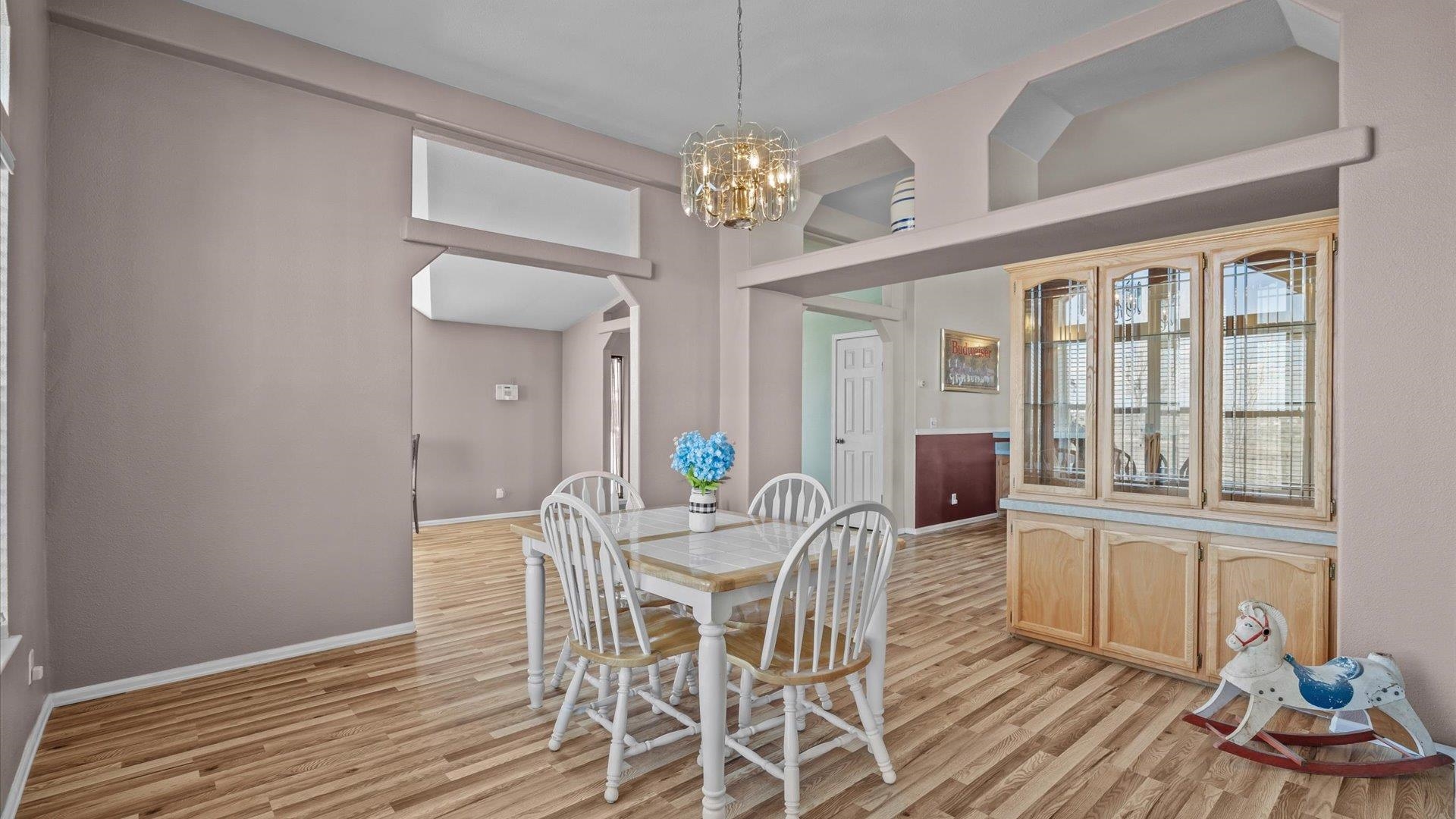 710 Old Highway Mack, CO 81525 - Photo 20 of 41 a view of a dining room with furniture wooden floor and chandelier
