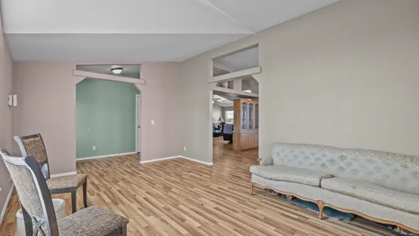 a bedroom with a bed and a couch