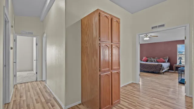 a view of a bedroom from the hallway