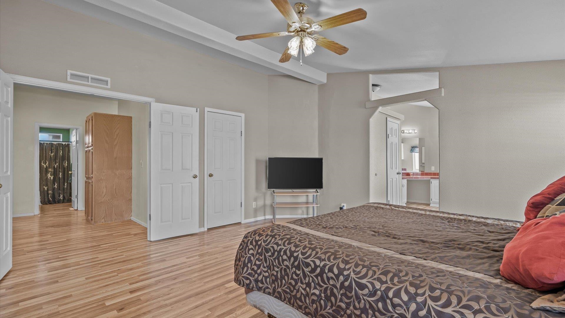 710 Old Highway Mack, CO 81525 - Photo 25 of 40 a bedroom with a bed and a flat screen tv