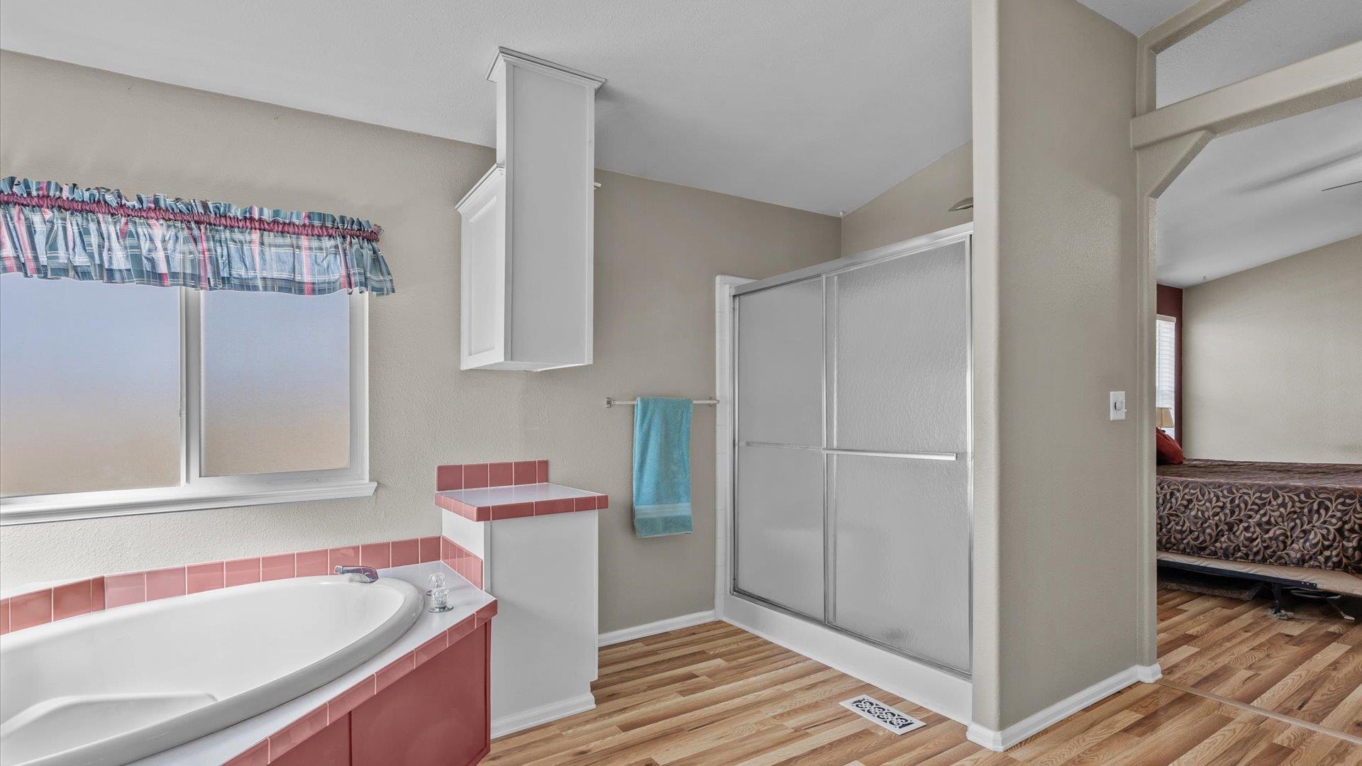 710 Old Highway Mack, CO 81525 - Photo 27 of 40 a bathroom with a bathtub and a shower