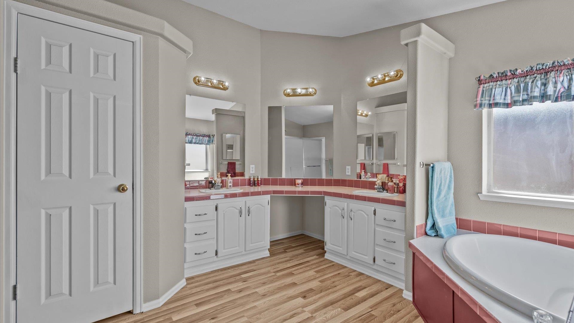 710 Old Highway Mack, CO 81525 - Photo 27 of 41 a large white kitchen with a sink and dishwasher with white cabinets