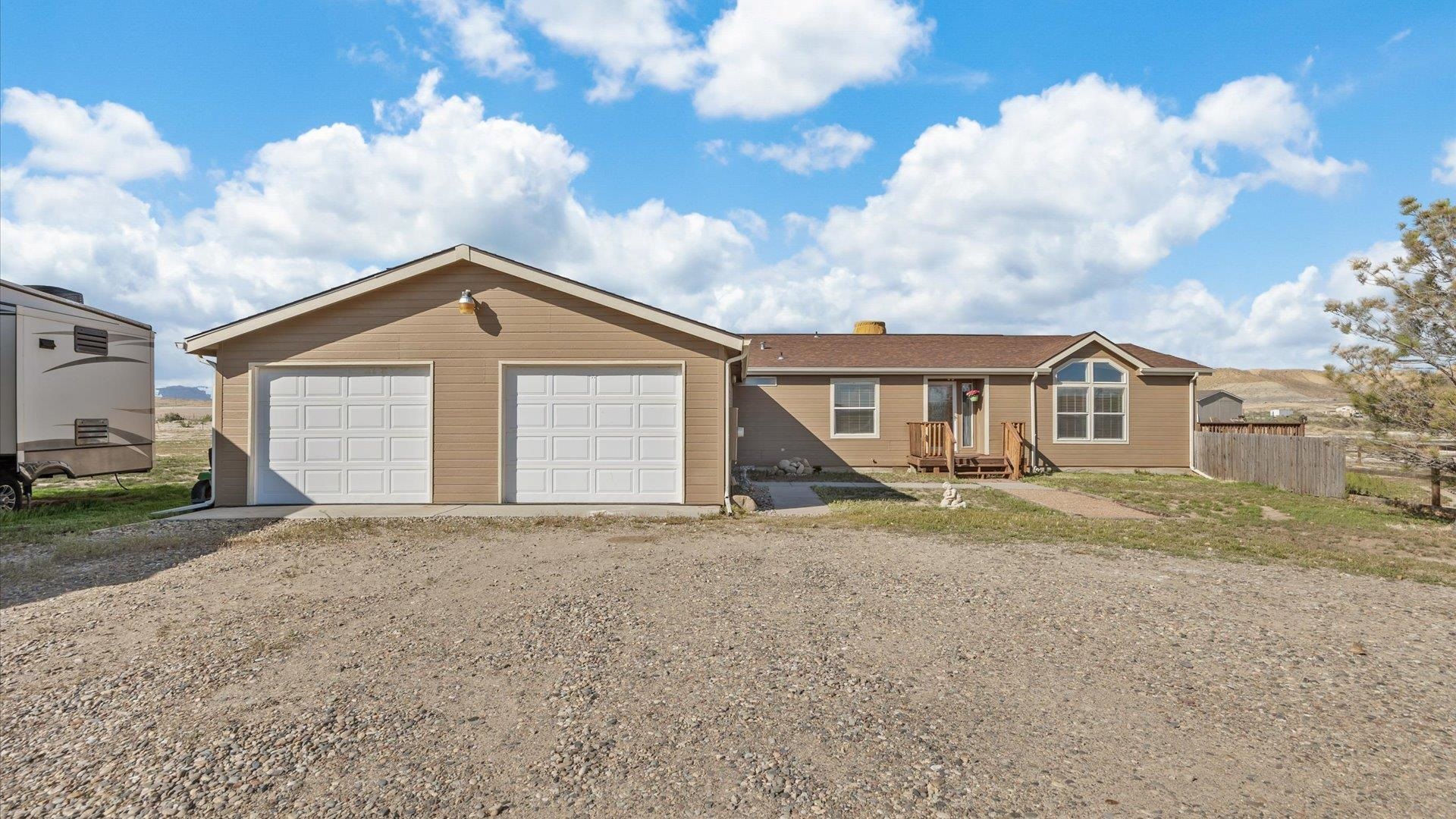 710 Old Highway Mack, CO 81525 - Photo 3 of 40 a view of a house with a yard
