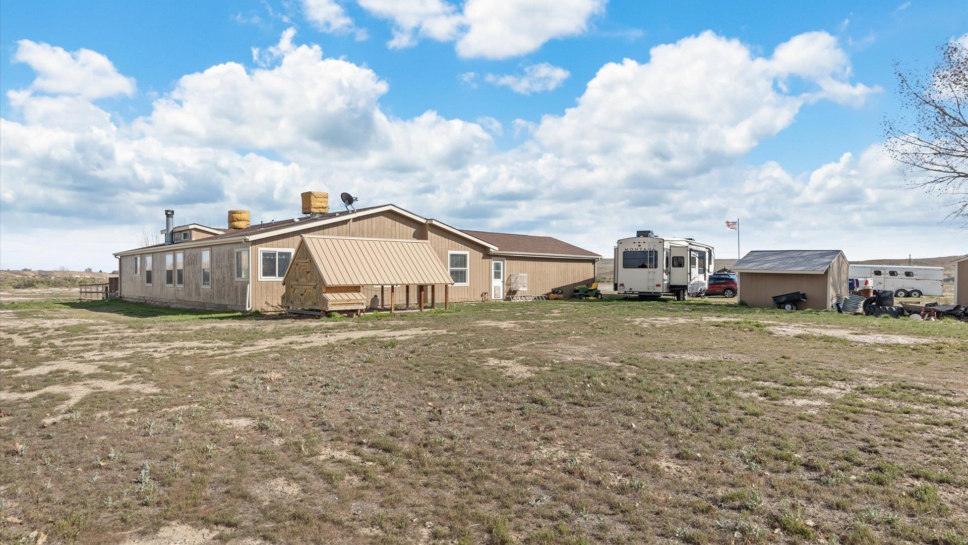 710 Old Highway Mack, CO 81525 - Photo 40 of 41 a view of a house with backyard and sitting area