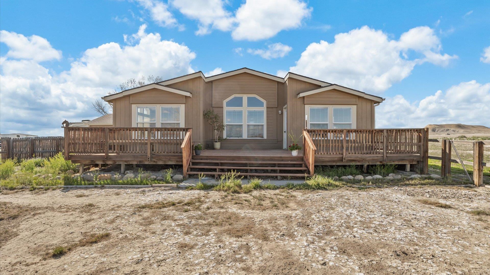 710 Old Highway Mack, CO 81525 - Photo 5 of 40 a view of a house with a yard