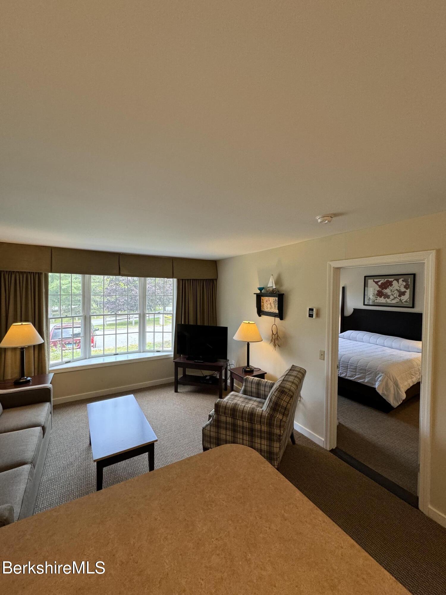 37 Corey Road, Unit 212 Hancock, MA 01237 - Photo 18 of 19 a bedroom with furniture and a window