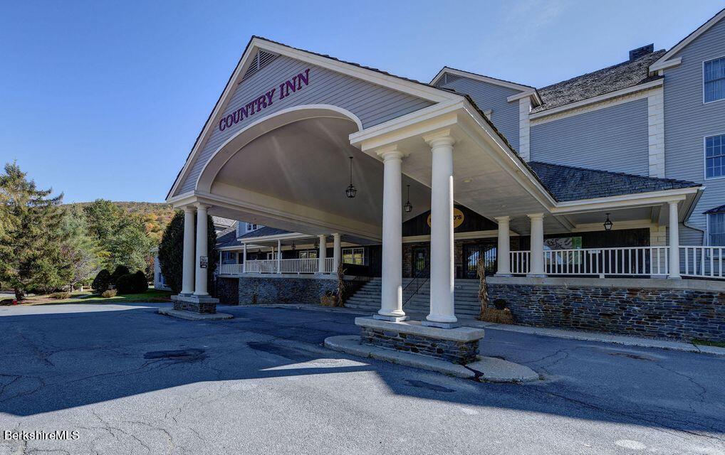 37 Corey Road, Unit 212 Hancock, MA 01237 - Photo 2 of 19 a view of a house with a porch