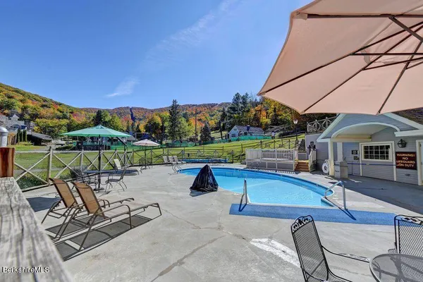 a view of a swimming pool with a patio