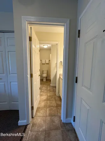 a view of a bathroom from a hallway