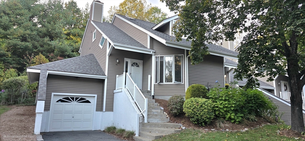 61 Southview Drive, Unit 61 Southwick, MA 01077 - Photo 1 of 28 a front view of a house with garden