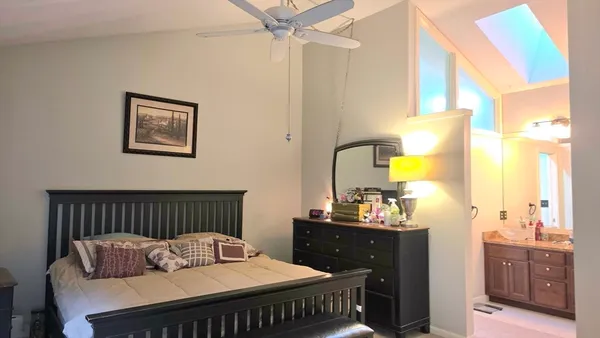 a bedroom with furniture and a window