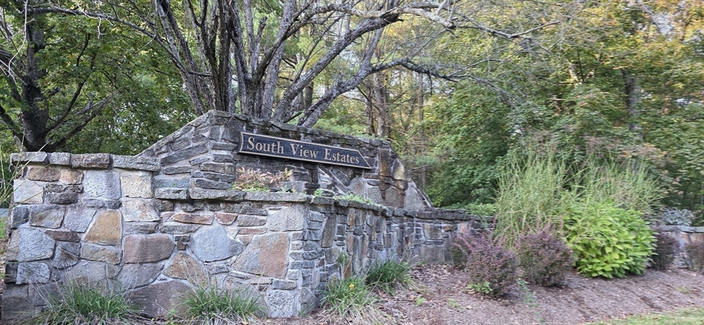 61 Southview Drive, Unit 61 Southwick, MA 01077 - Photo 20 of 28 a view of a wooden house with large trees