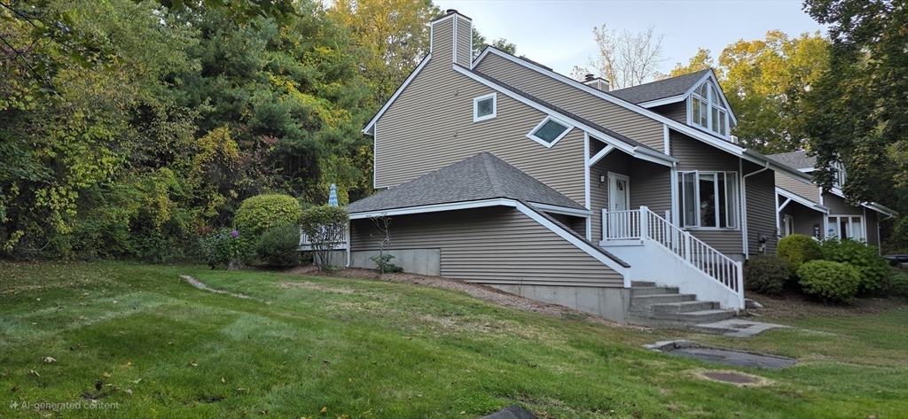 61 Southview Drive, Unit 61 Southwick, MA 01077 - Photo 2 of 28 a front view of a house with a garden
