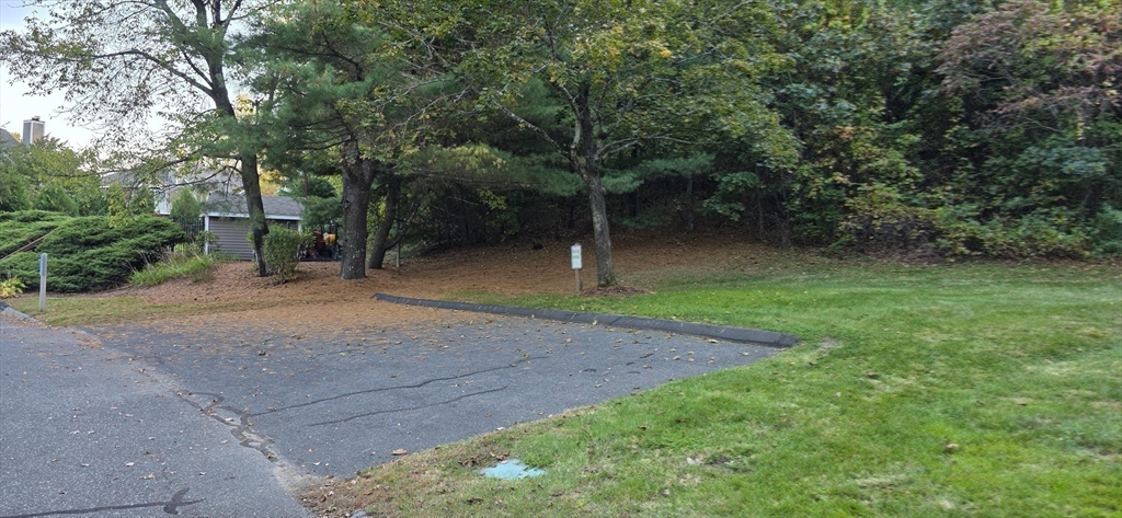 61 Southview Drive, Unit 61 Southwick, MA 01077 - Photo 25 of 28 a backyard of a house with lots of green space
