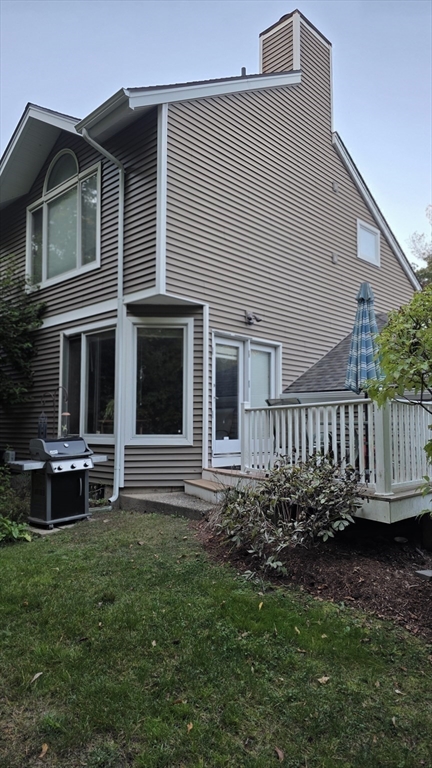61 Southview Drive, Unit 61 Southwick, MA 01077 - Photo 26 of 28 a view of a house with a yard and a garden