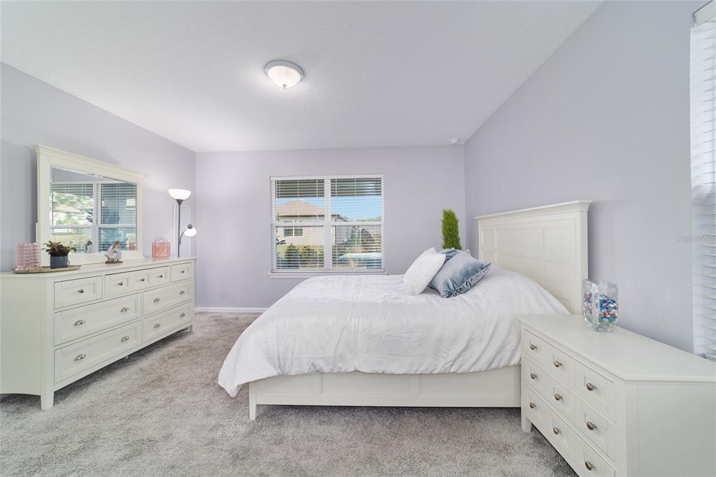 5472 Southwest 85th Ave Road Ocala, FL 34481 - Photo 17 of 44 a bedroom with a bed and window