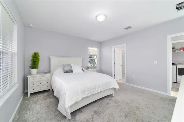 a bedroom with a bed and a closet