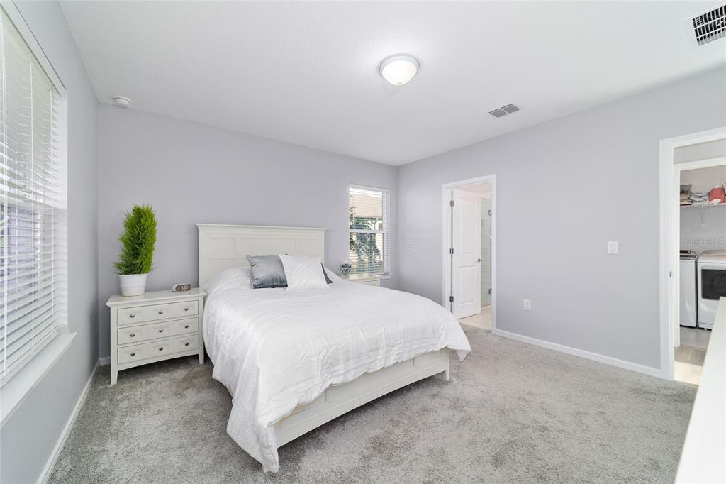 5472 Southwest 85th Ave Road Ocala, FL 34481 - Photo 18 of 44 a bedroom with a bed and a closet