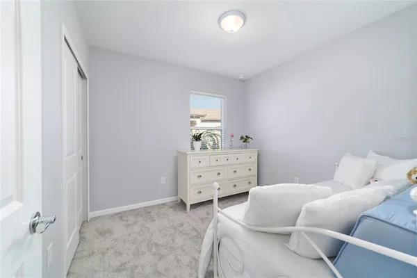 a bedroom with a bed and furniture