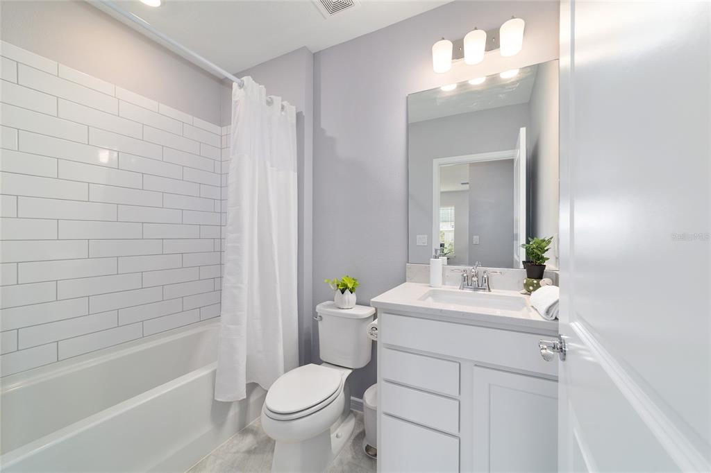 5472 Southwest 85th Ave Road Ocala, FL 34481 - Photo 25 of 44 a bathroom with a sink a toilet and shower