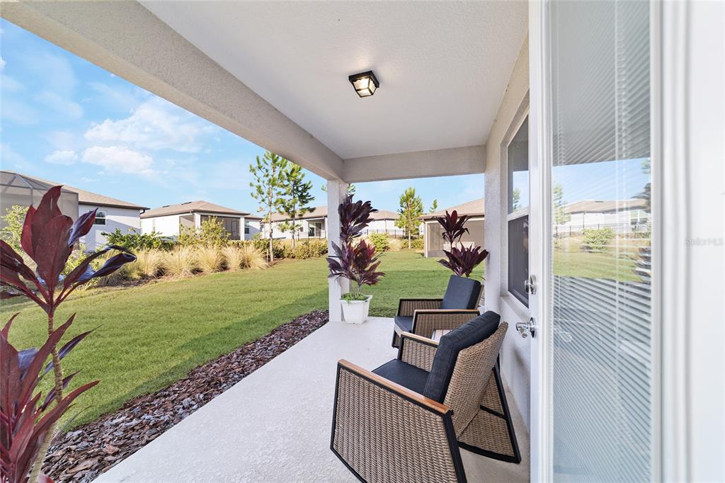 5472 Southwest 85th Ave Road Ocala, FL 34481 - Photo 27 of 44 a view of a porch with furniture
