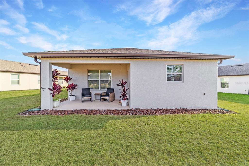 5472 Southwest 85th Ave Road Ocala, FL 34481 - Photo 28 of 44 a front view of a house with porch