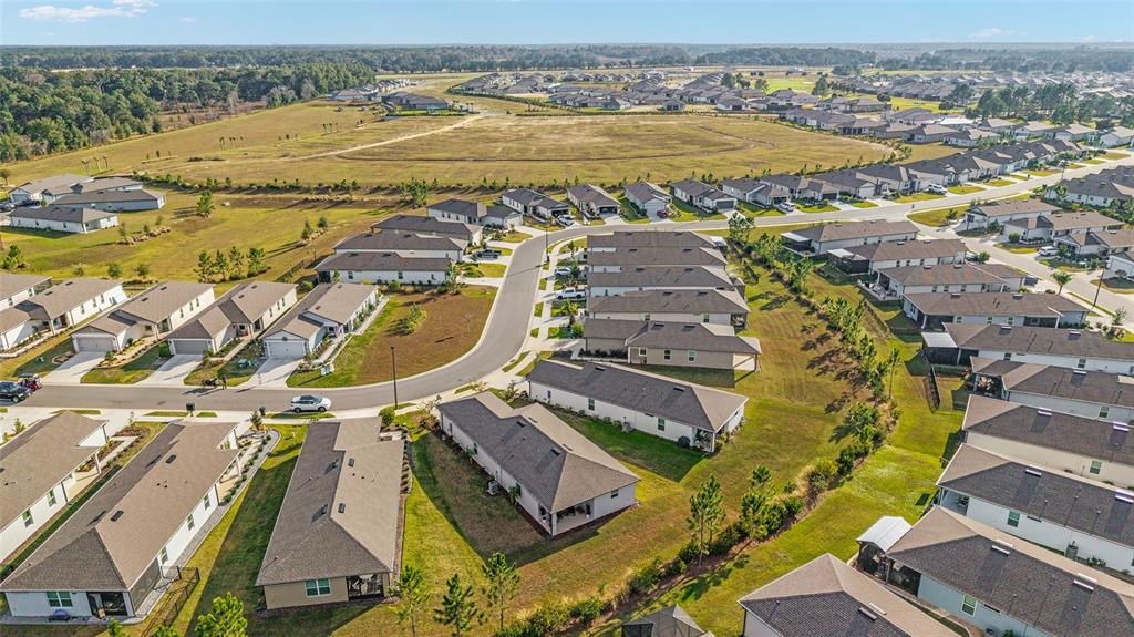 5472 Southwest 85th Ave Road Ocala, FL 34481 - Photo 30 of 44 an aerial view of residential houses with outdoor space