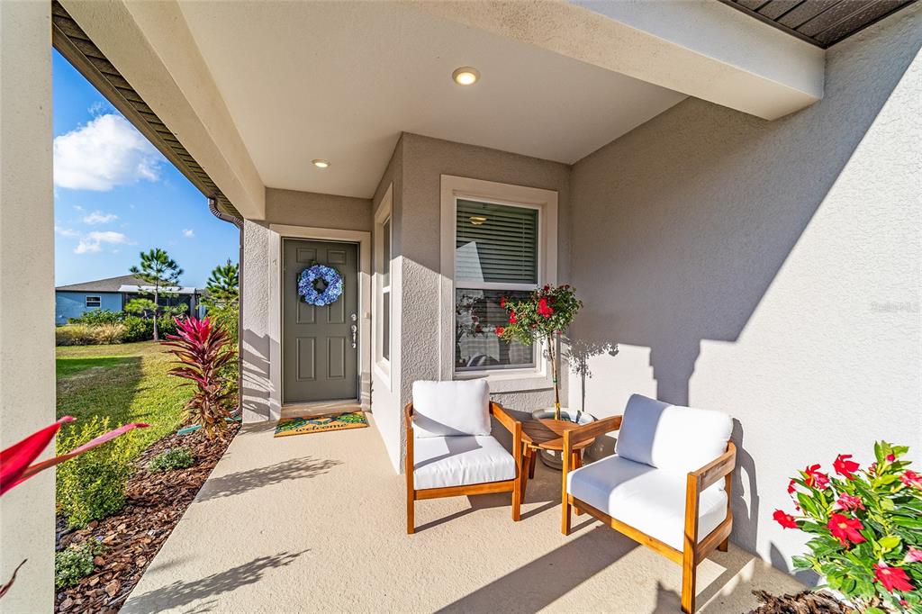 5472 Southwest 85th Ave Road Ocala, FL 34481 - Photo 3 of 44 a view of a dining room with furniture and a potted plant