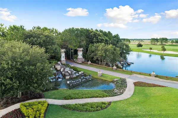a view of a swimming pool with a yard