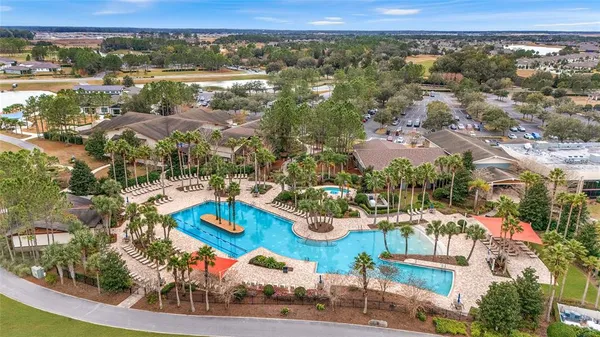 an aerial view of residential building and lake