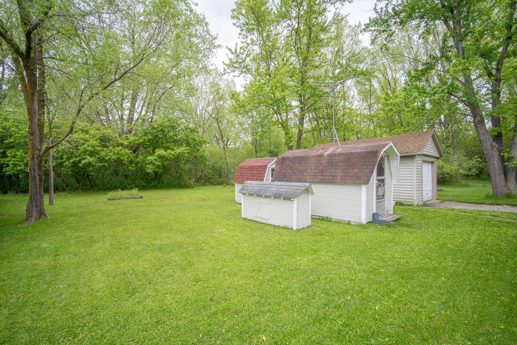 7180 North River Road Trenton, WI 53090 - Photo 17 of 18 garage and multiple sheds
