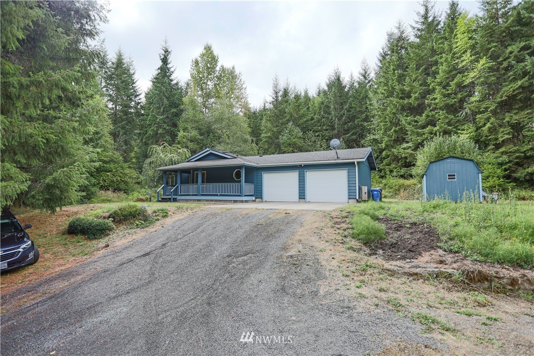 1763 Bunker Creek Road Chehalis, WA 98532 - Photo 3 of 40 a front view of house with yard and trees all around