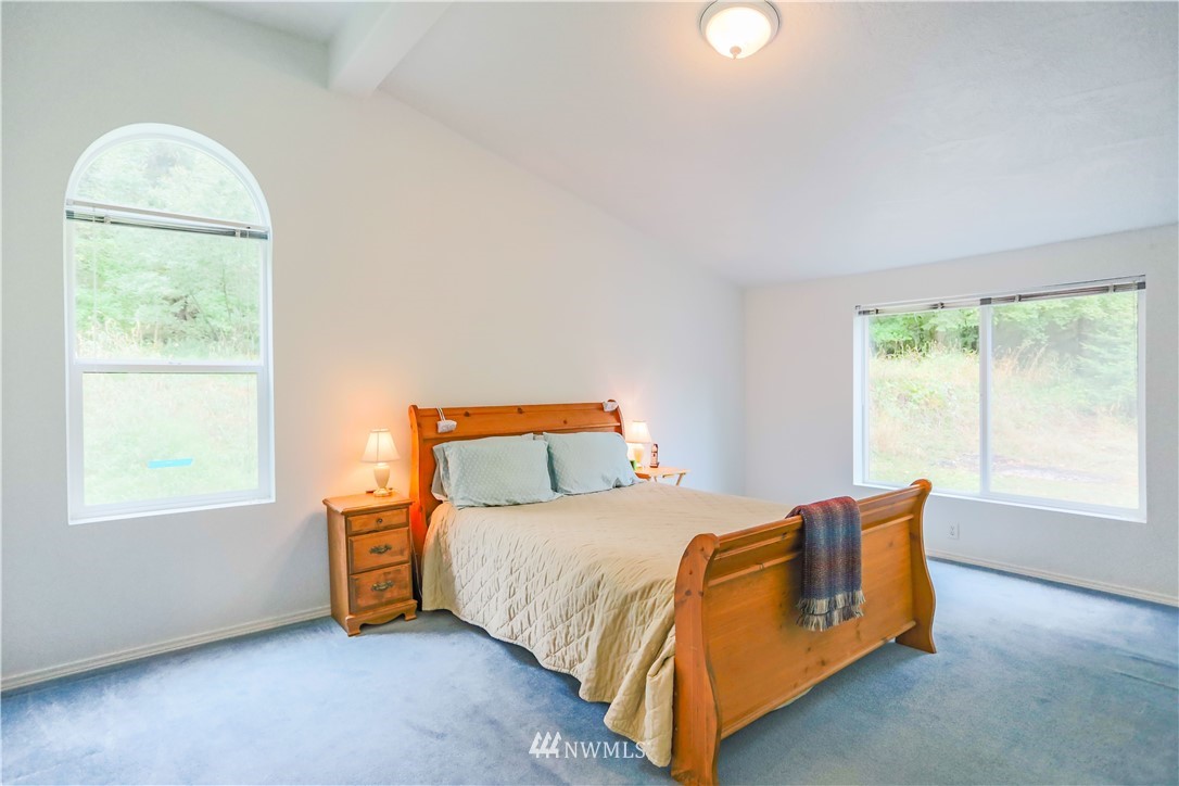 1763 Bunker Creek Road Chehalis, WA 98532 - Photo 22 of 40 a bedroom with a bed and a window