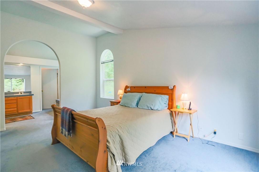 1763 Bunker Creek Road Chehalis, WA 98532 - Photo 23 of 40 a bedroom with a bed and a mirror