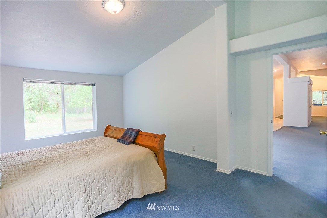 1763 Bunker Creek Road Chehalis, WA 98532 - Photo 25 of 40 a bedroom with a bed and window