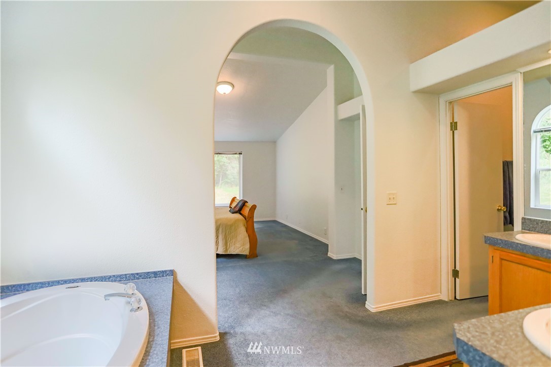 1763 Bunker Creek Road Chehalis, WA 98532 - Photo 28 of 40 a view of a room that has a bed and a bathroom in it