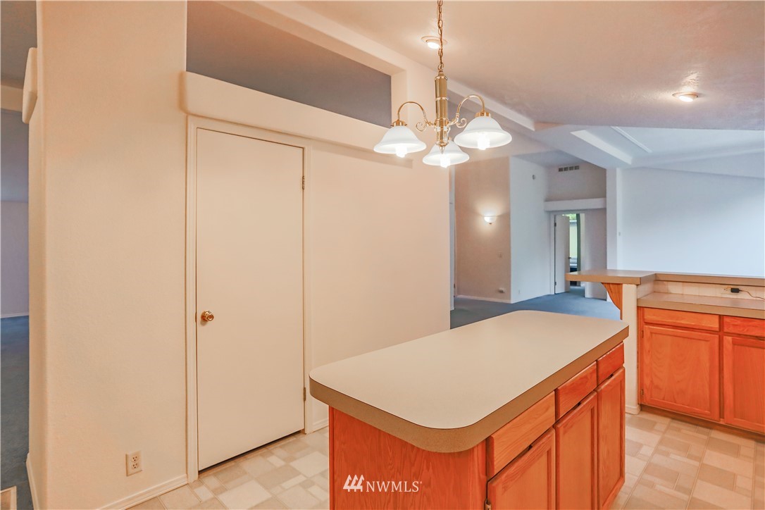1763 Bunker Creek Road Chehalis, WA 98532 - Photo 10 of 40 a room with a chandelier furniture and kitchen view