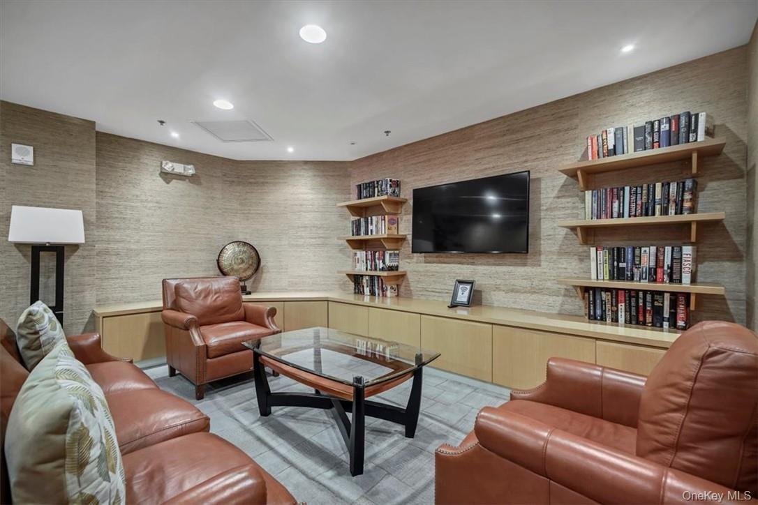 1 Renaissance Square, Unit 9D White Plains, NY 10601 - Photo 15 of 17 a living room with furniture and a flat screen tv