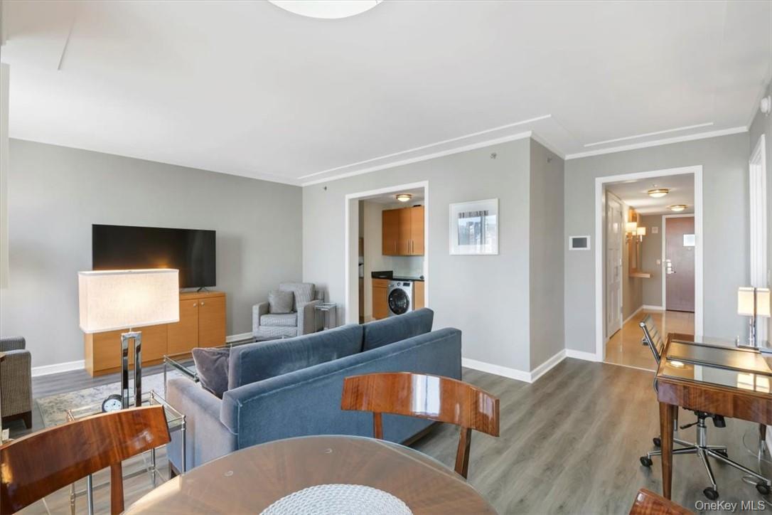1 Renaissance Square, Unit 9D White Plains, NY 10601 - Photo 2 of 17 a living room with furniture and a wooden floor