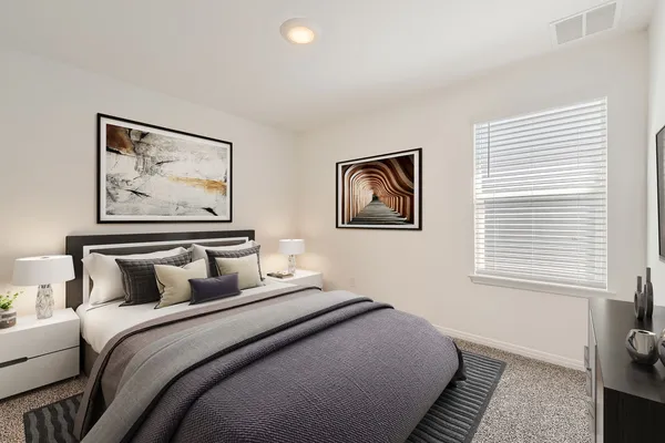 a bedroom with bed and a window