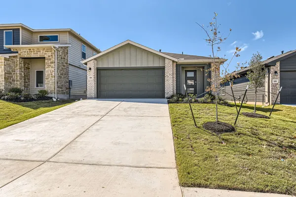 a view of a house with sitting area and garden