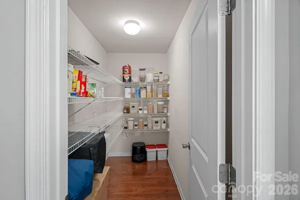 a view of hallway with stairs and furniture