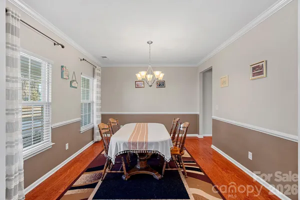 a room with furniture and a chandelier