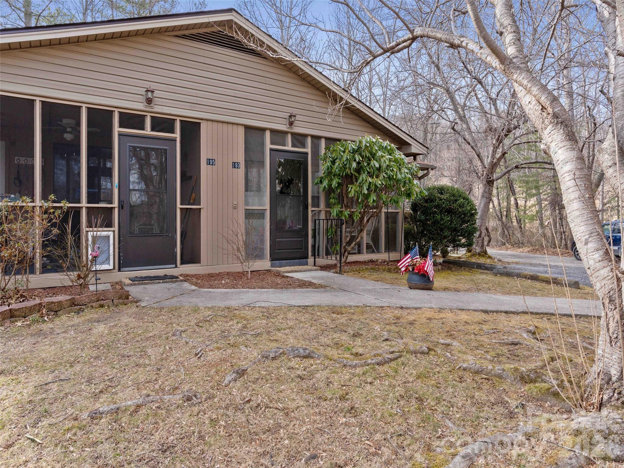 193 Freedom Road Hendersonville, NC 28792 - Photo 20 of 22 a view of a house with a yard and large tree
