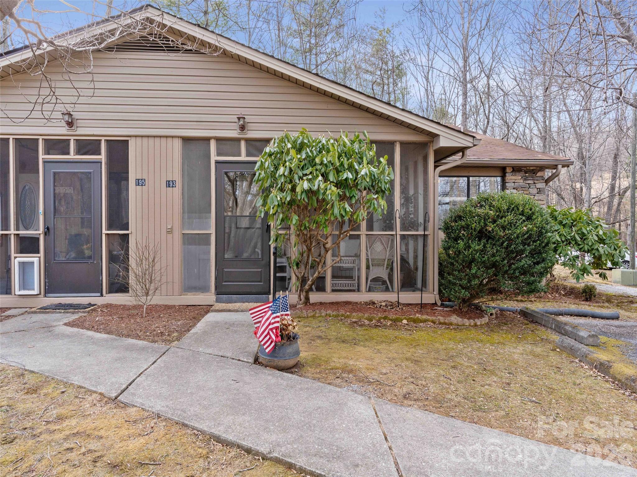193 Freedom Road Hendersonville, NC 28792 - Photo 21 of 22 a front view of a house with a porch