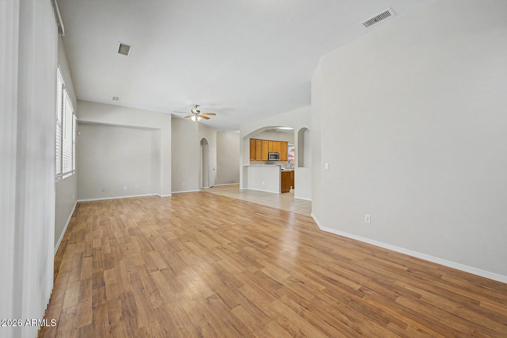 11199 West Monte Vista Road Avondale, AZ 85392 - Photo 3 of 36 a view of empty room with wooden floor