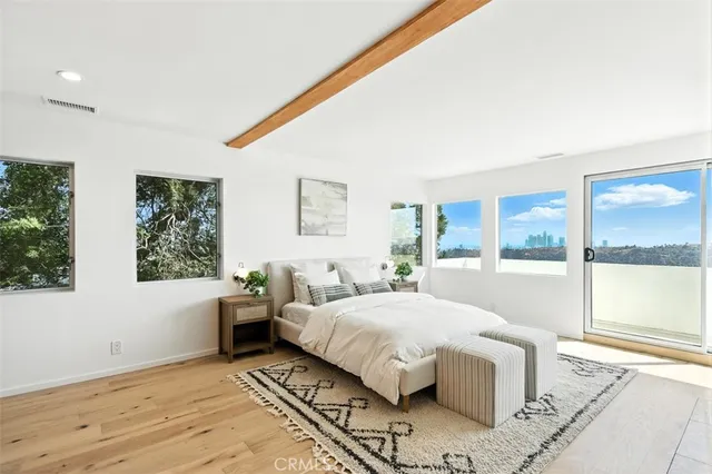 a bathroom with a sink a tub and a mirror